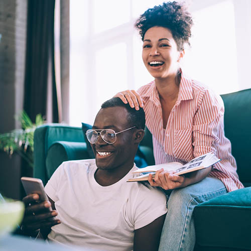 Couple Smiling At Phone